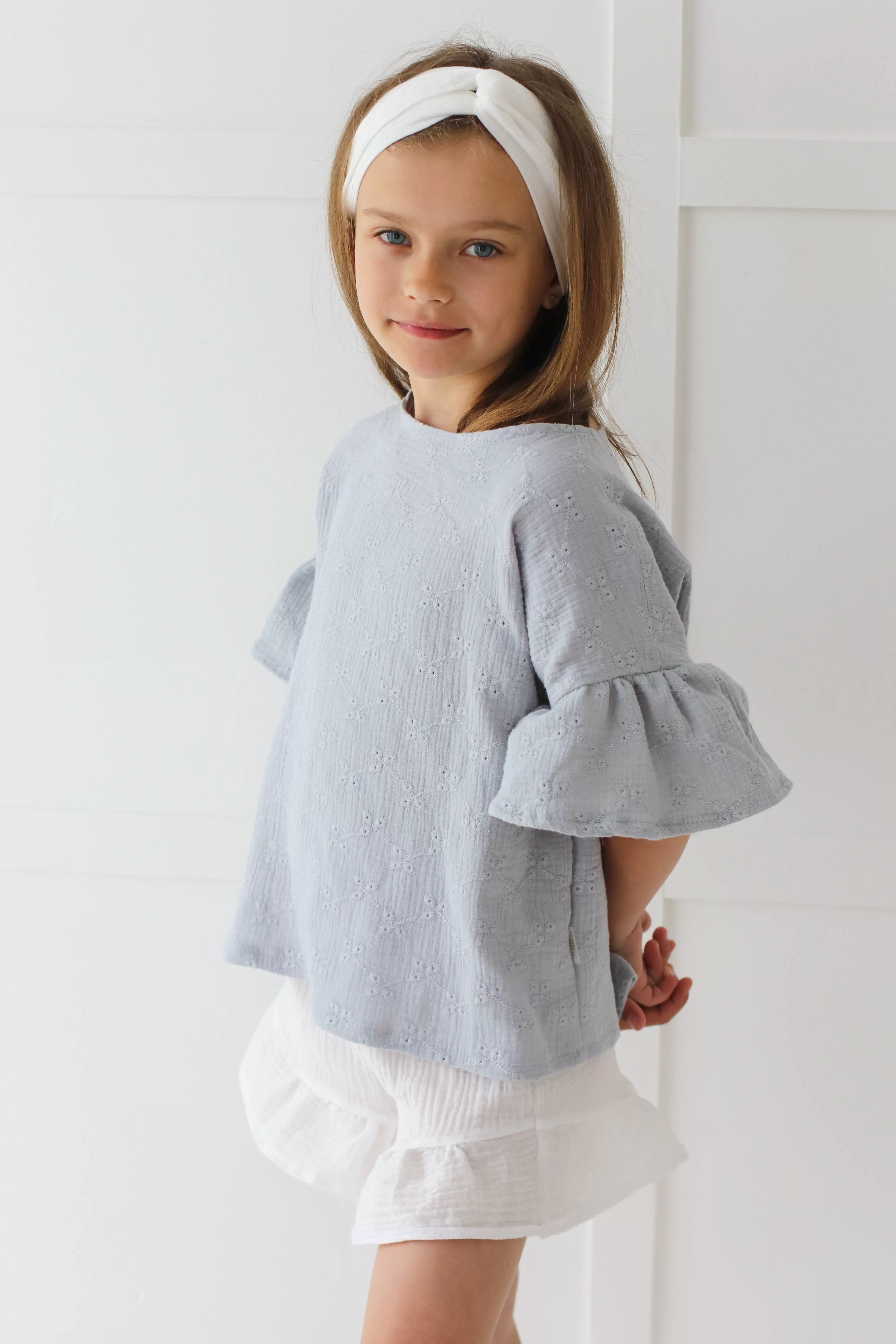 Embroidered muslin summer blouse with flounce sleeves