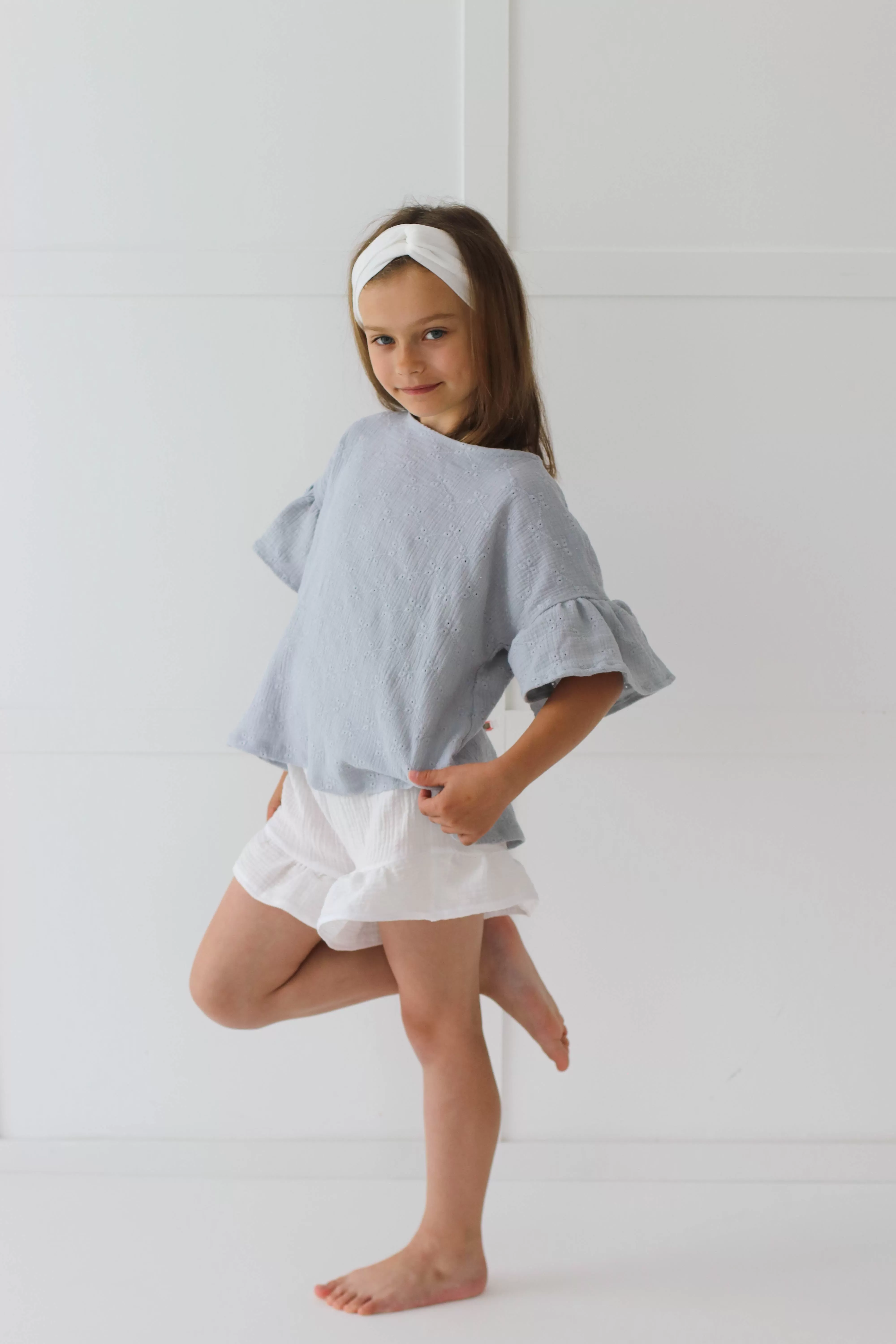 Embroidered muslin summer blouse with flounce sleeves