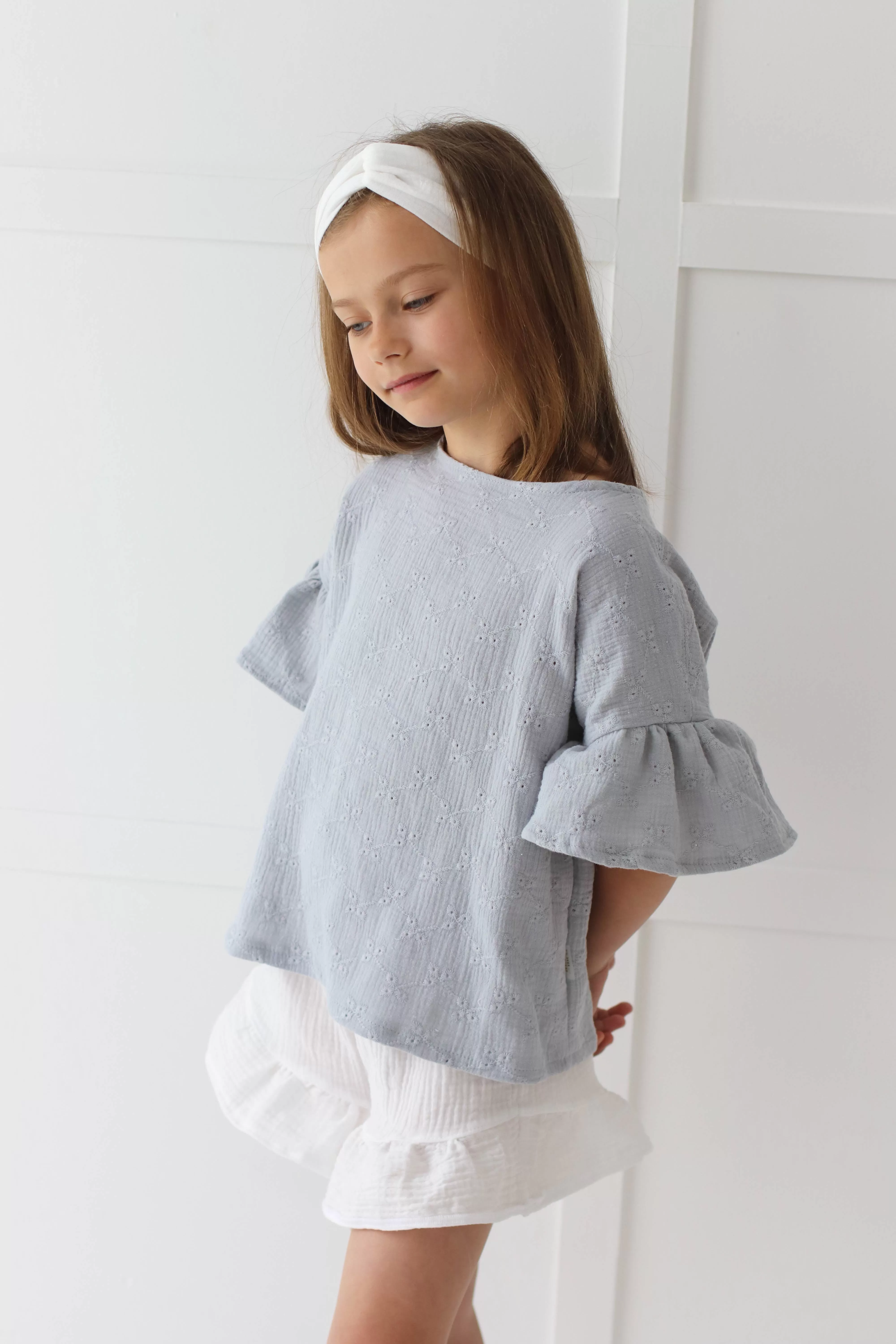 Embroidered muslin summer blouse with flounce sleeves