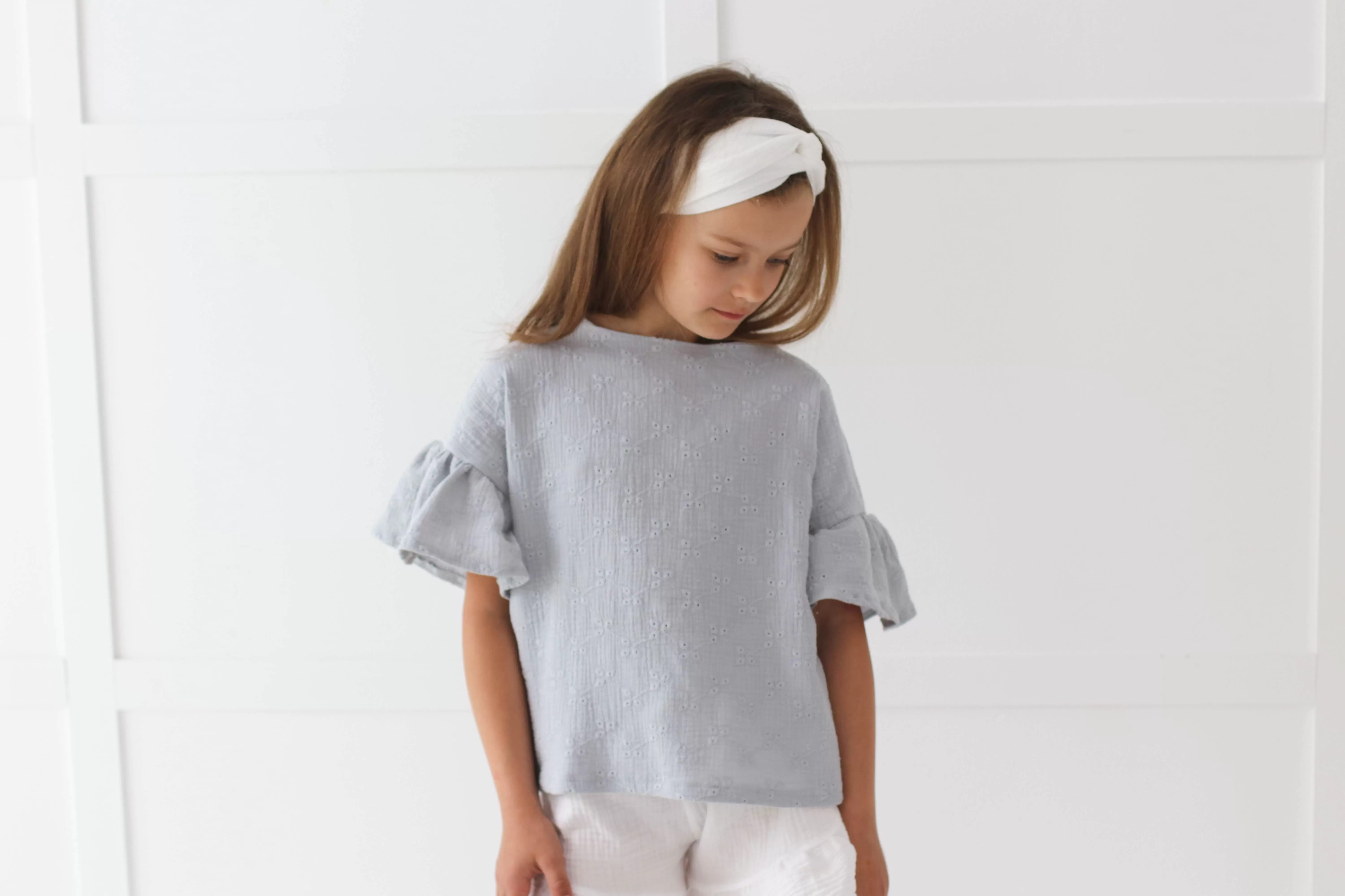 Embroidered muslin summer blouse with flounce sleeves