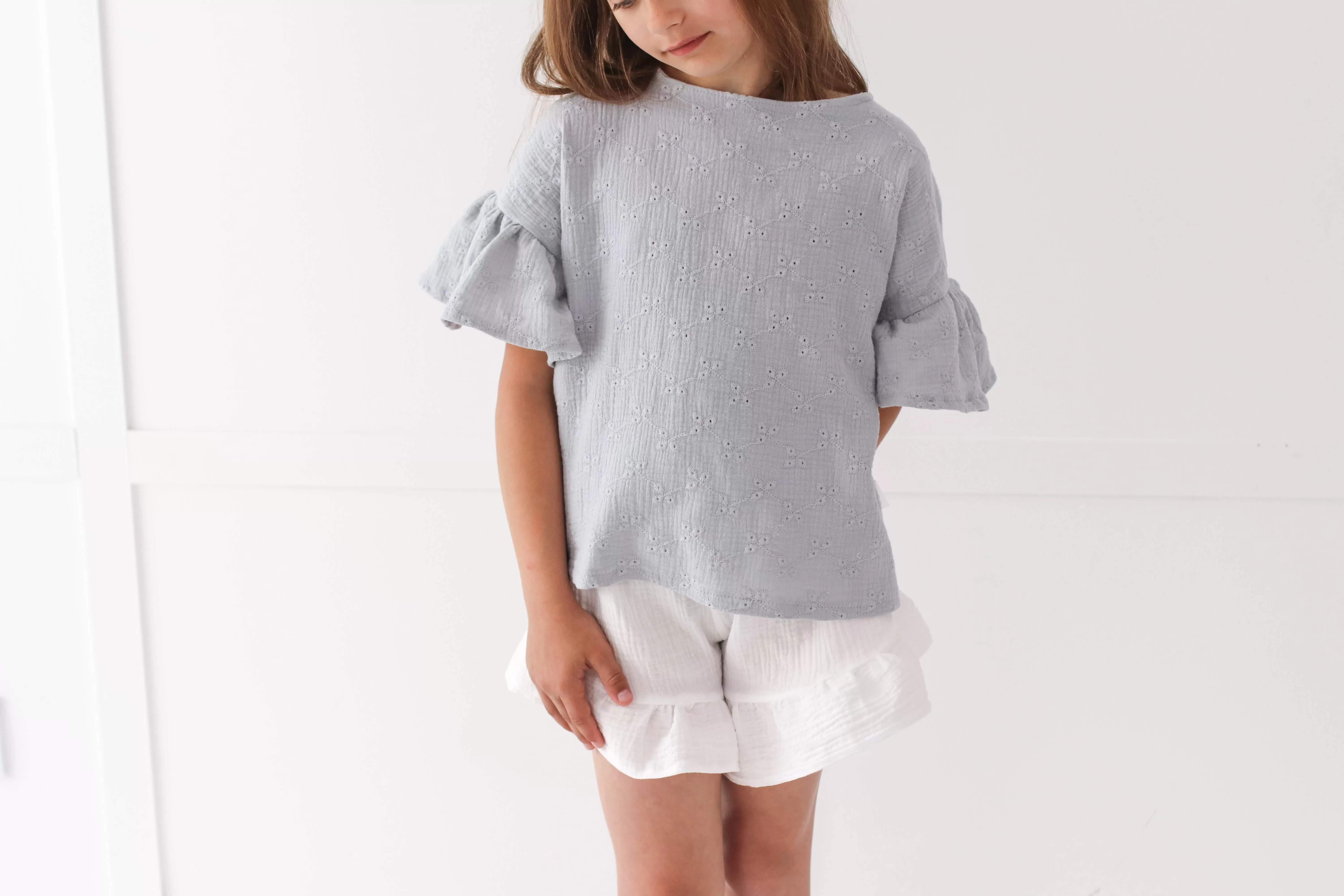 Embroidered muslin summer blouse with flounce sleeves