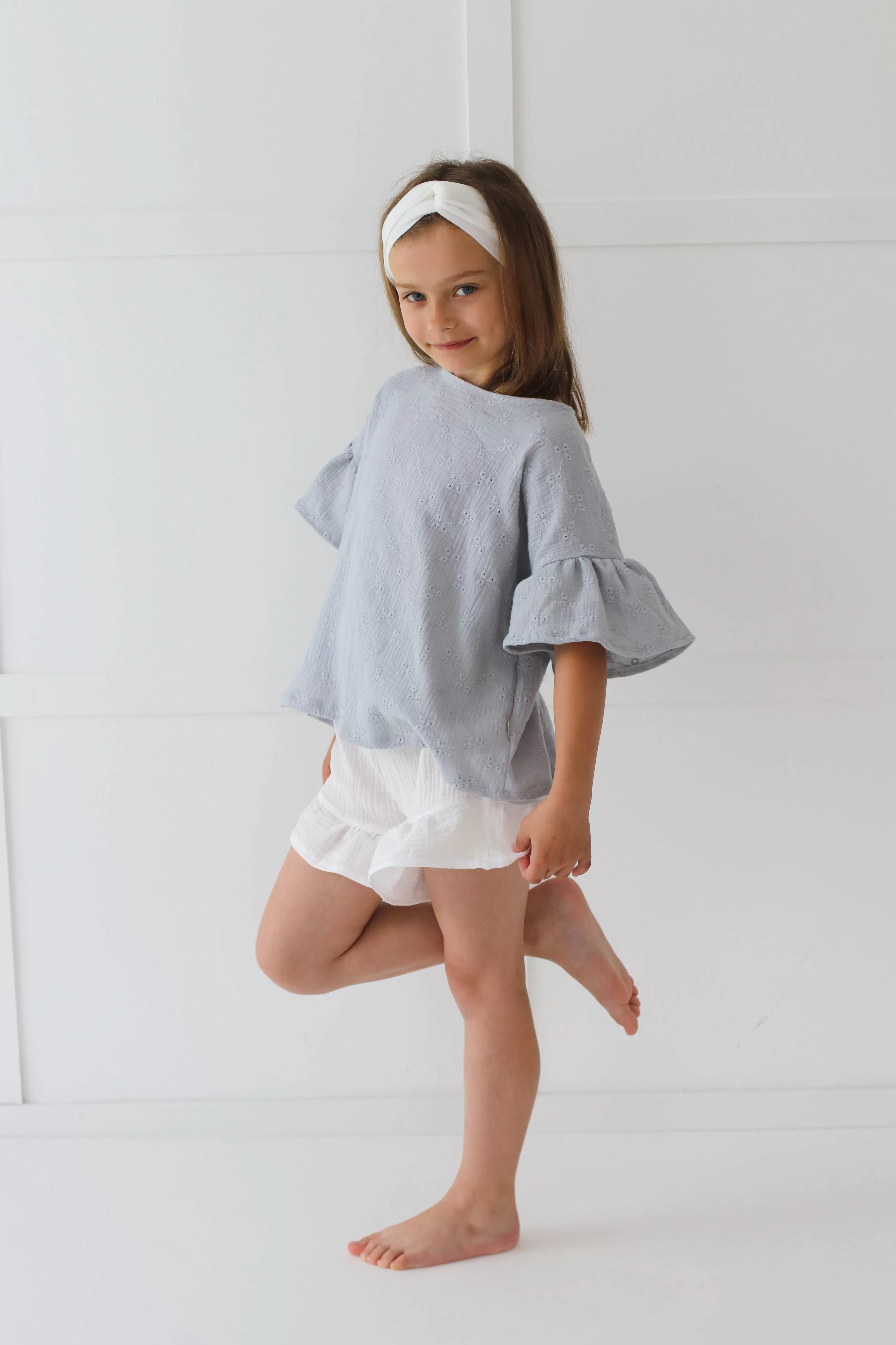 Embroidered muslin summer blouse with flounce sleeves